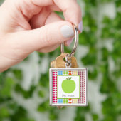 Porte-clés Les points multicolores Apple vert ont (main)