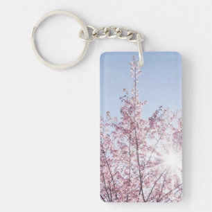 Porte-clés les rayons du soleil traversent les fleurs roses d