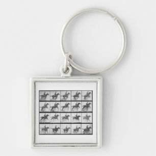 Porte-clés L'homme et le cheval sautant une barrière,