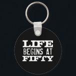 Porte-clés Life begins at 50 Funny Birthday keychain<br><div class="desc">Life begins at 50 funny 50th Birthday round button keychain. Fun quote key chain for fifty year old men and women. Change age year accordingly. Faded vintage typography design with custom age. Add your own custom number. Cool surprise Birthday party gift idea for legendary dad, father, husband, uncle, grandpa, brother,...</div>