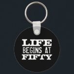 Porte-clés Life begins at 50 Funny Birthday keychain<br><div class="desc">Life begins at 50 funny 50th Birthday round button keychain. Fun quote key chain for fifty year old men and women. Change age year accordingly. Faded vintage typography design with custom age. Add your own custom number. Cool surprise Birthday party gift idea for legendary dad, father, husband, uncle, grandpa, brother,...</div>