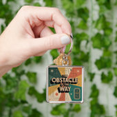 Porte-clés L'obstacle est la voie (main)
