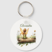 Porte-clés Lonely Fairy assis sur un journal (Verso)