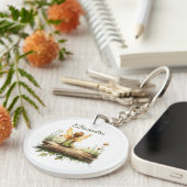 Porte-clés Lonely Fairy assis sur un journal (Devant droit)