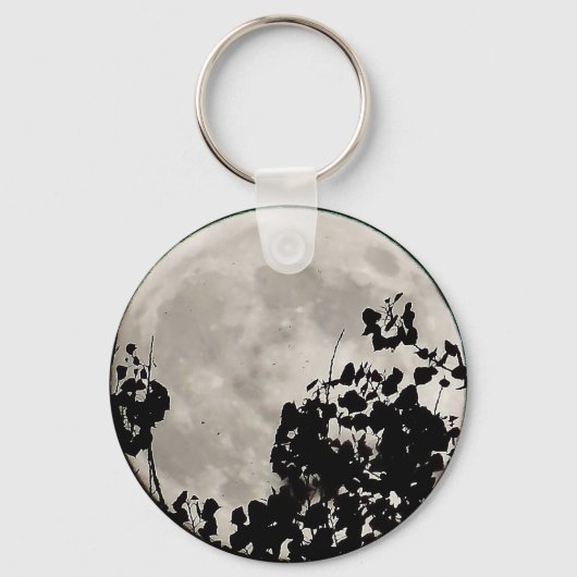 Porte-clés Lune derrière des feuilles sombres (Recto)