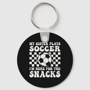 Porte-clés Ma sœur joue au football, je suis là pour les snac