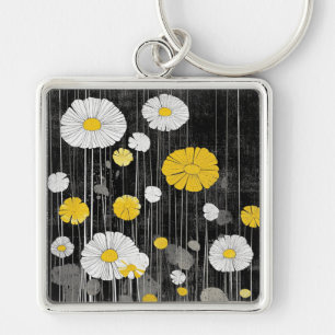 Porte-clés Marguerites blanches et jaunes sur fond gris noir