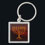 Porte-clés Menorah de Moshe<br><div class="desc">Dans le Torah Moshe Rabbenu est dit, "vous ferez un Menorah de l'or pur, battu, le Menorah serez faits, sa base, sa branche, ses gobelets, ses boutons, et ses fleurs seront martelées de elle, " [25:31 de Shmot] et plus tard, "voyez, et construisez, selon leur forme que vous êtes montrés...</div>