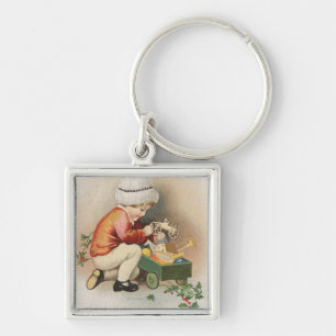 Porte-clés Mon Noël WishKid observant des jouets