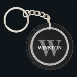 Porte-clés Monogramme classique : Noir, Blanc et G personnali<br><div class="desc">Voici notre Porte - clé "Classic Monogram" - un mélange parfait d'élégance et de fonctionnalité. Cet accessoire sophistiqué est conçu pour ceux qui apprécient un style classique avec une touche personnelle. L'élégante palette de couleurs noir, blanc et gris dégage une élégance intemporelle qui vient compléter n'importe quel ensemble de touches....</div>