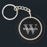 Porte-clés Monogramme classique : Noir, Blanc et G personnali<br><div class="desc">Voici notre Porte - clé "Classic Monogram" - un mélange parfait d'élégance et de fonctionnalité. Cet accessoire sophistiqué est conçu pour ceux qui apprécient un style classique avec une touche personnelle. L'élégante palette de couleurs noir, blanc et gris dégage une élégance intemporelle qui vient compléter n'importe quel ensemble de touches....</div>