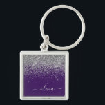 Porte-clés Monogramme de Parties scintillant d'argent violet<br><div class="desc">Parties scintillant argentée et mauve Éperche Script Monogramme Nom Clés (Porte - clé). Cela rend le cadeau parfait pour 16 ans,  mariage,  douche nuptiale,  anniversaire,  baby shower ou bachelorette pour quelqu'un qui aime le luxe glam et les styles chic.</div>