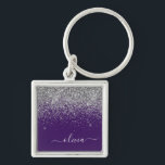 Porte-clés Monogramme de Parties scintillant d'argent violet<br><div class="desc">Parties scintillant argentée et mauve Éperche Script Monogramme Nom Clés (Porte - clé). Cela rend le cadeau parfait pour 16 ans,  mariage,  douche nuptiale,  anniversaire,  baby shower ou bachelorette pour quelqu'un qui aime le luxe glam et les styles chic.</div>