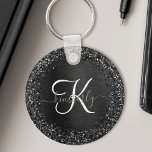 Porte-clés Monogramme d'étincelle à Parties scintillant noire<br><div class="desc">Personnalisez facilement ce design porte - clé élégant et branché avec une jolie parties scintillant brillante noire sur un arrière - plan métallique brossé noir.</div>