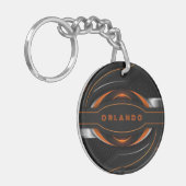 Porte-clés Monographie de jeu géométrique en argent, noir, or (Devant gauche)