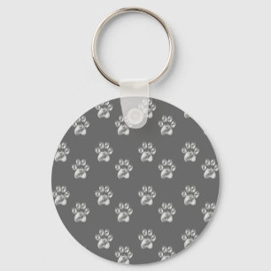 Porte-clés Motif de patte mignon et élégant sur fond gris fon