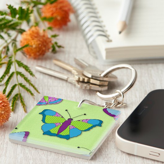 Porte-clés Motif papillon patchwork sur fond vert