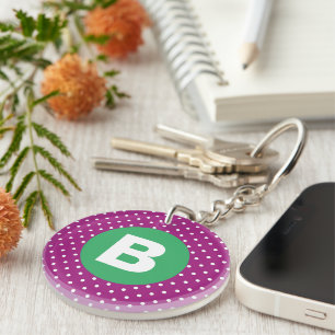 Porte-clés Motif pois violets sur fond vert avec monogramme