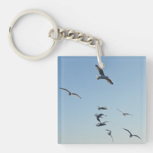 Porte-clés Mouettes volant au-dessus des vagues de l'océan Oi