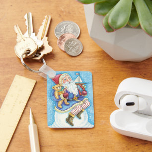 Porte-clés Noël mignon, le Père Noël sur Snowball avec jouets