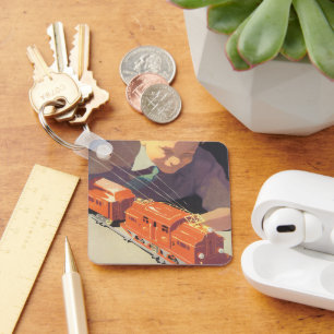 Porte-clés Noël vintage, garçon jouant avec des trains jouets