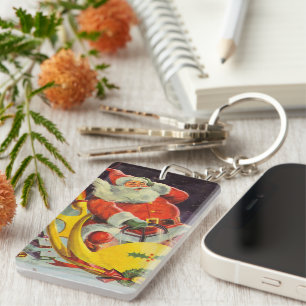 Porte-clés Noël vintage, le Père Noël dans un vaisseau spatia