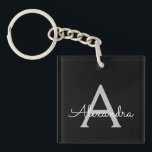 Porte-clés Noir Argent moderne Script Girl Monogramme Nom<br><div class="desc">Noir et Argent Simple Script Monogramme Nom Porte - clé. Cela rend le cadeau parfait pour 16 ans,  mariage,  douche nuptiale,  anniversaire,  baby shower ou bachelorette pour quelqu'un qui aime le luxe glam et les styles chic.</div>