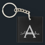 Porte-clés Noir Argent moderne Script Girl Monogramme Nom<br><div class="desc">Noir et Argent Simple Script Monogramme Nom Porte - clé. Cela rend le cadeau parfait pour 16 ans,  mariage,  douche nuptiale,  anniversaire,  baby shower ou bachelorette pour quelqu'un qui aime le luxe glam et les styles chic.</div>