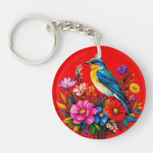 Porte-clés Oiseau bleu perché parmi des fleurs printanières c