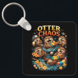 Porte-clés Otter Chaos<br><div class="desc">A playful illustration of mischievous otters splashing in water while enjoying snacks,  toys,  and summer fun in a burst of joyful chaos.</div>
