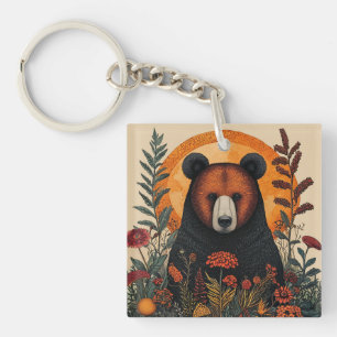 Porte-clés Ours artistique parmi des fleurs botaniques vibran
