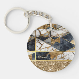 Porte-clés Pailleté doré élégant sur fond de marbre noir.