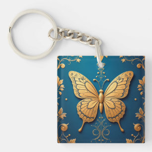 Porte-clés Papillon doré orné avec motif floral