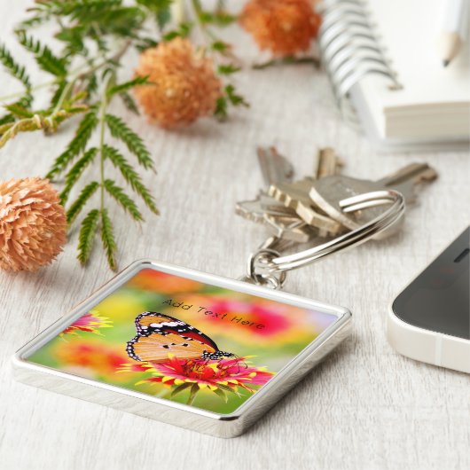 Porte-clés Papillon monarque sur Fleur rouge et jaune (Côté)