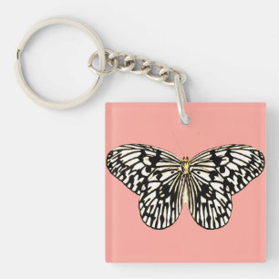 Porte-clés Papillon noir et blanc, fond rose corail
