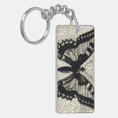 Porte-clés Papillon noir et blanc sur Arrière - plan fissuré (Devant gauche)
