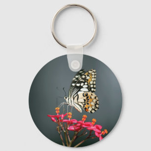 Porte-clés Papillon noir et jaune blanc sur Fleurs roses