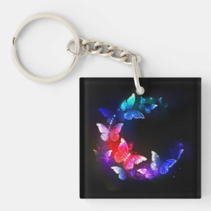 Porte-clés Papillons de nuit néon lumineux sur fond noir