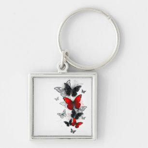 Porte-clés Papillons noirs et rouges volants