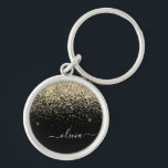 Porte-clés Parties scintillant Noir Or Script Monogramme Nom<br><div class="desc">Parties scintillant à étincelles dorées et noires Script Monogramme Nom Keychains (Porte - clé). Cela rend le cadeau parfait pour 16 ans,  mariage,  douche nuptiale,  anniversaire,  baby shower ou bachelorette pour quelqu'un qui aime le luxe glam et les styles chic.</div>