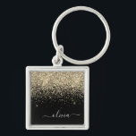 Porte-clés Parties scintillant Noir Or Script Monogramme Nom<br><div class="desc">Parties scintillant à étincelles dorées et noires Script Monogramme Nom Keychains (Porte - clé). Cela rend le cadeau parfait pour 16 ans,  mariage,  douche nuptiale,  anniversaire,  baby shower ou bachelorette pour quelqu'un qui aime le luxe glam et les styles chic.</div>