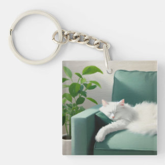 Porte-clés Peinture de chat dormant sur un canapé vert