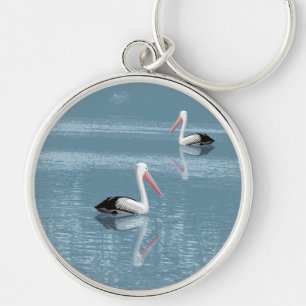 Porte-clés Pélican Couple pagayage sur Eau Bleue Calme