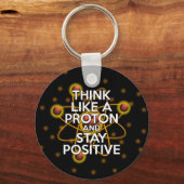 PORTE-CLÉS PENSEZ COMME UN PROTON ET RESTEZ POSITIF (Recto)