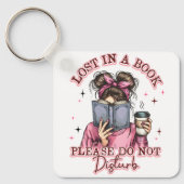 Porte-clés Perdu dans un livre... (Recto)
