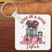 Porte-clés Perdu dans un livre... (Recto)