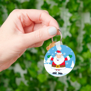 Porte-clés Père Noël dans une scène hivernale enneigée