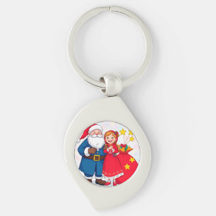 Porte-clés Père Noël et fille avec un sac de cadeaux