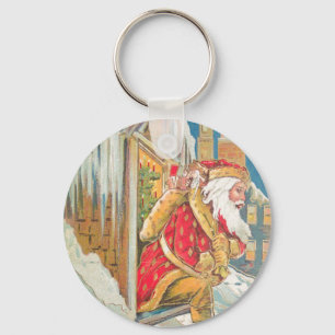 Porte-clés Père Noël sur un toit neigeux