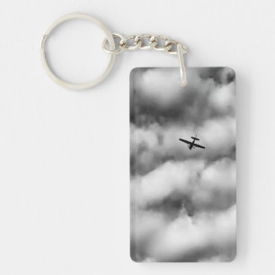 Porte-clés Petit avion volant dans un ciel nuageux Photo